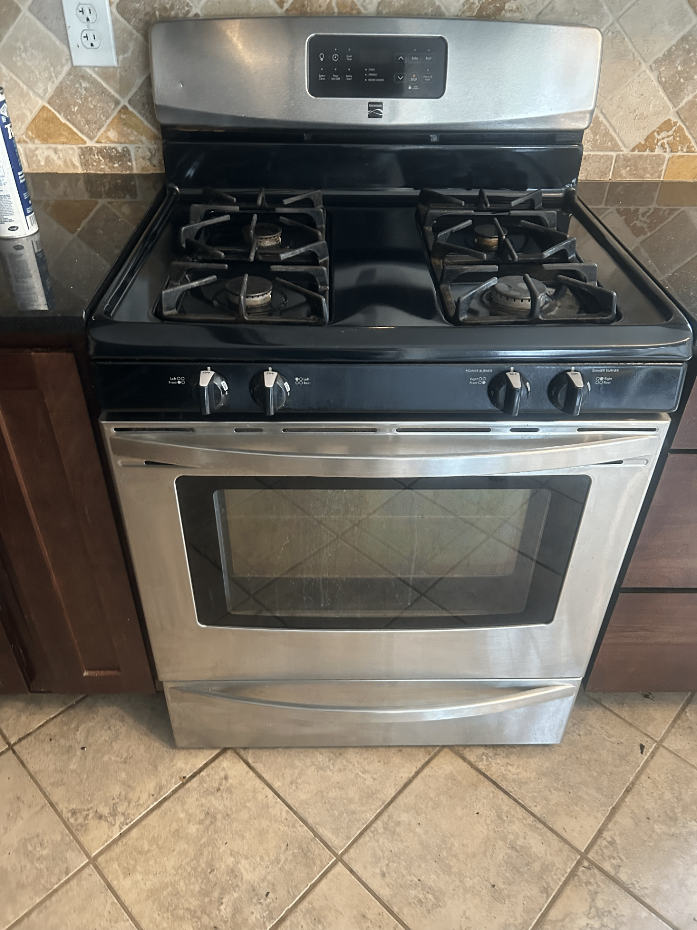 Stovetop after deep cleaning with a polished black cooktop